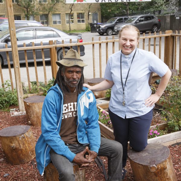 The Reverend Dr. Alison Falby, right, with Lee, the gardener, in the Rose Garden outside All Saints Church Community Centre at 315 Dundas Street East at the corner of Dundas and Sherbourne streets in downtown Toronto on September 4, 2019. Photo/Michael Hudson